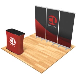 Exhibition booth setup with a wooden floor, a red curved podium labeled Crane Labs, and a three-panel display backdrop with Crane Labs logo.