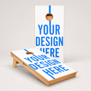 Custom Cornhole Boards - View 360 Print Two white wooden cornhole boards with a bold blue 'YOUR DESIGN HERE' message and round holes, set against a neutral backdrop.