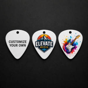GuitarPicks - View 360 Print Three white guitar picks on a dark background: left says 'CUSTOMIZE YOUR OWN', middle shows the 'ELEVATE MUSIC' logo with mountains, right features a colorful splashed guitar design.